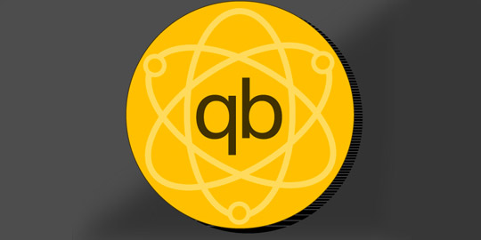 golden round image with nuclear atom and letters q and b 
