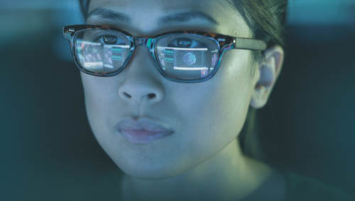 Image of a female staring at something adjacent to the camera