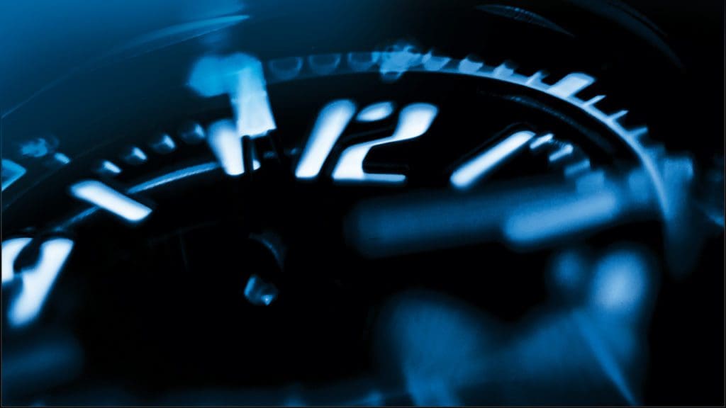 Image of a timepiece, focused at the 12 hour mark