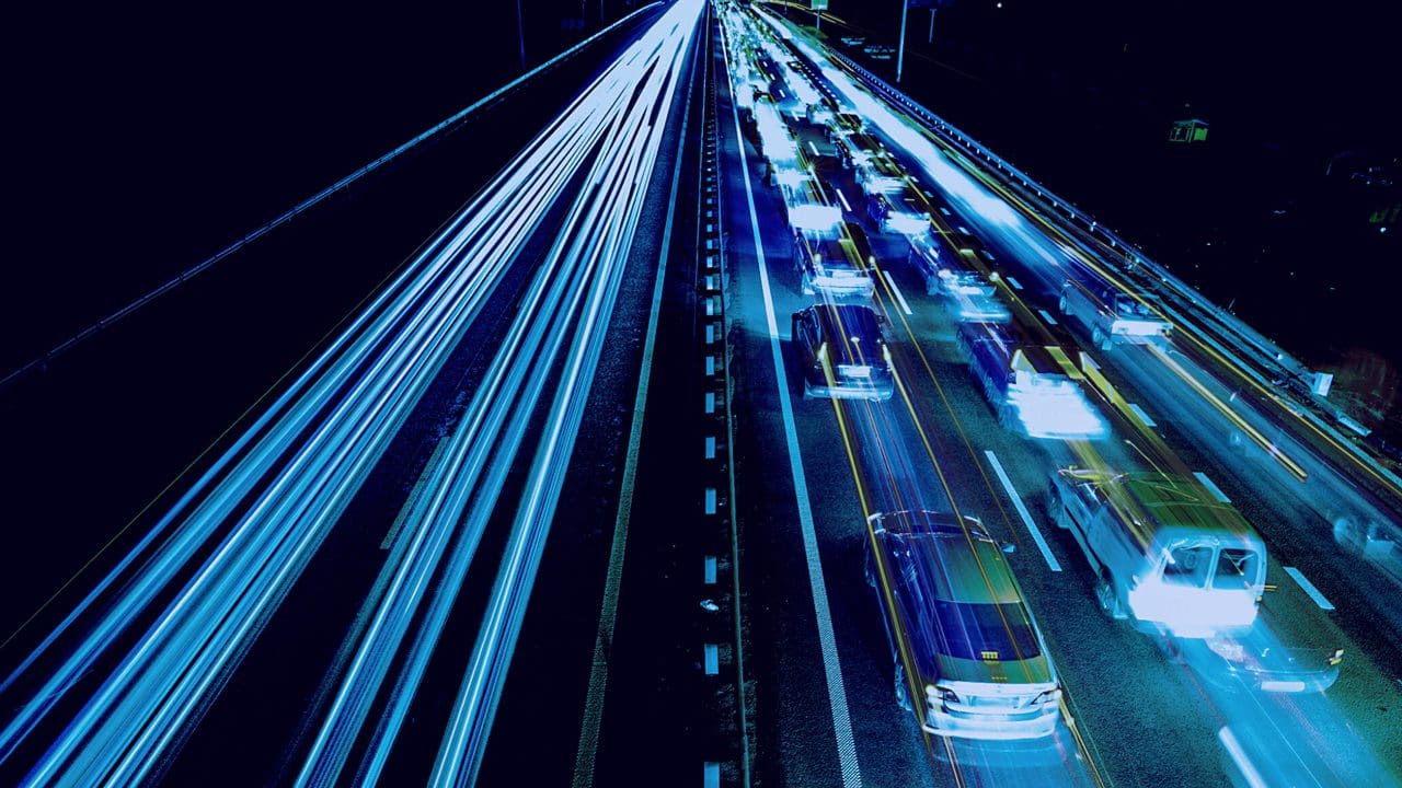 Mobility: Vehicles in traffic at night.