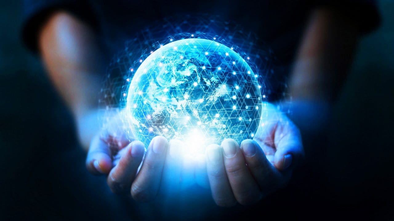 Pair of hands holding a globe.