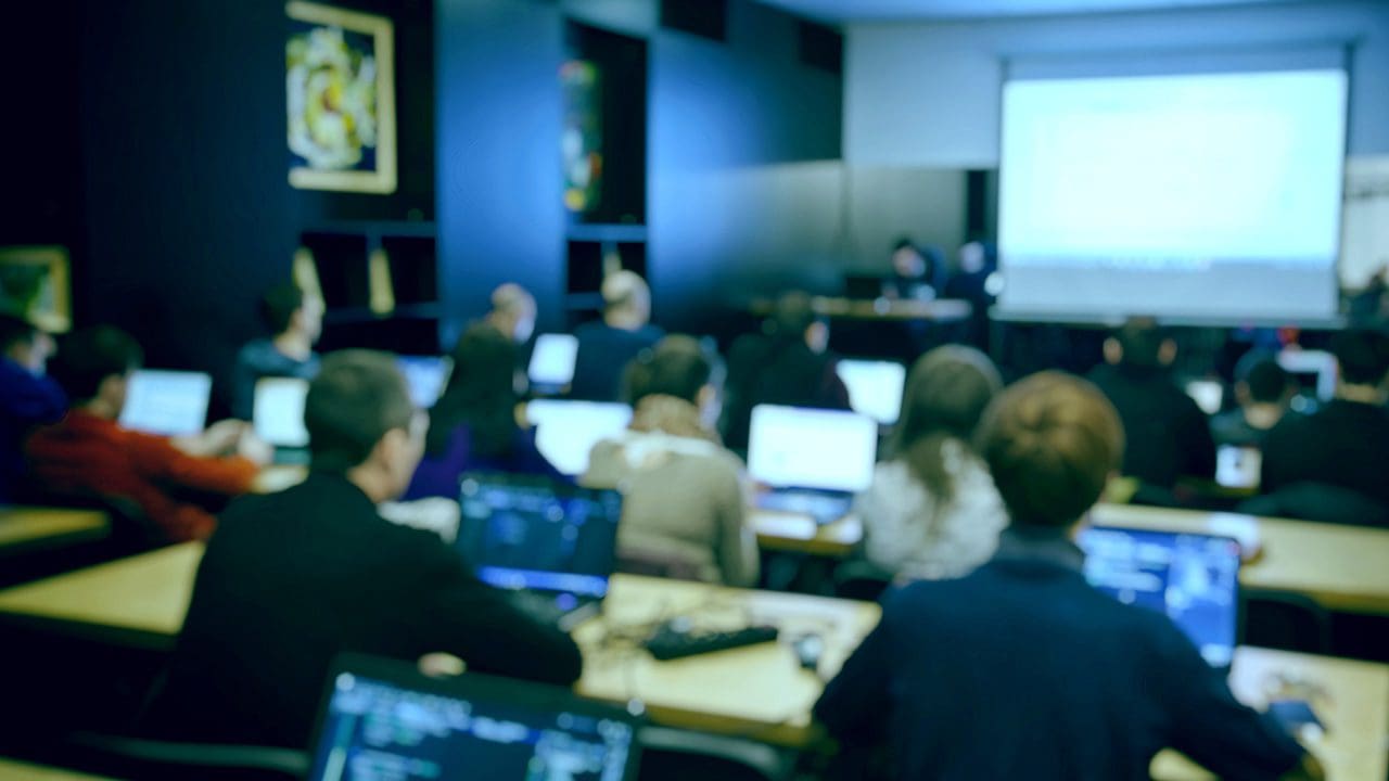 Image of business students in a classroom.