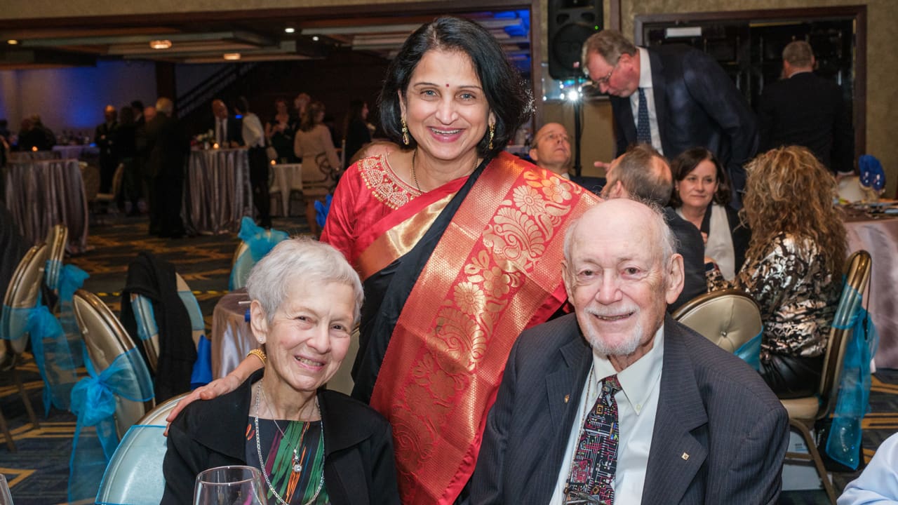 Three people posing for a picture