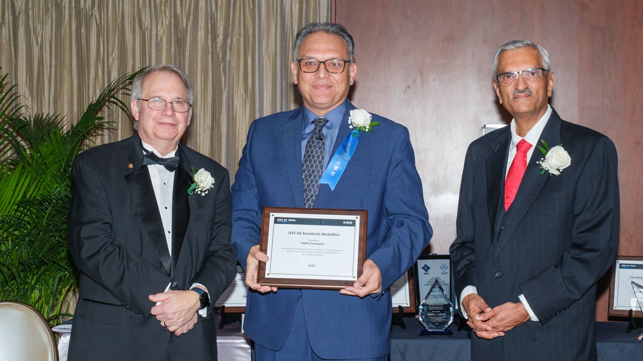 Recipient posing with award