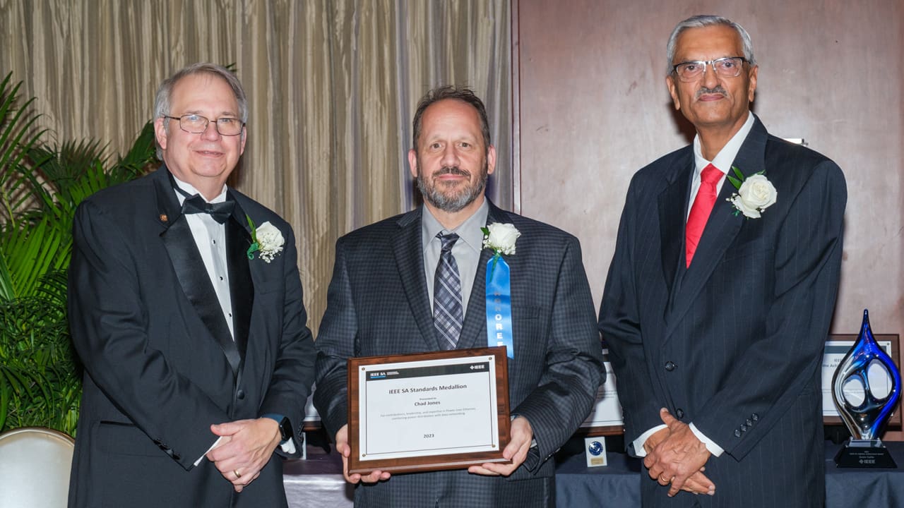 Recipient posing with award