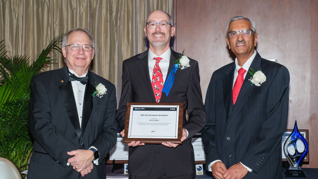 Recipient posing with award