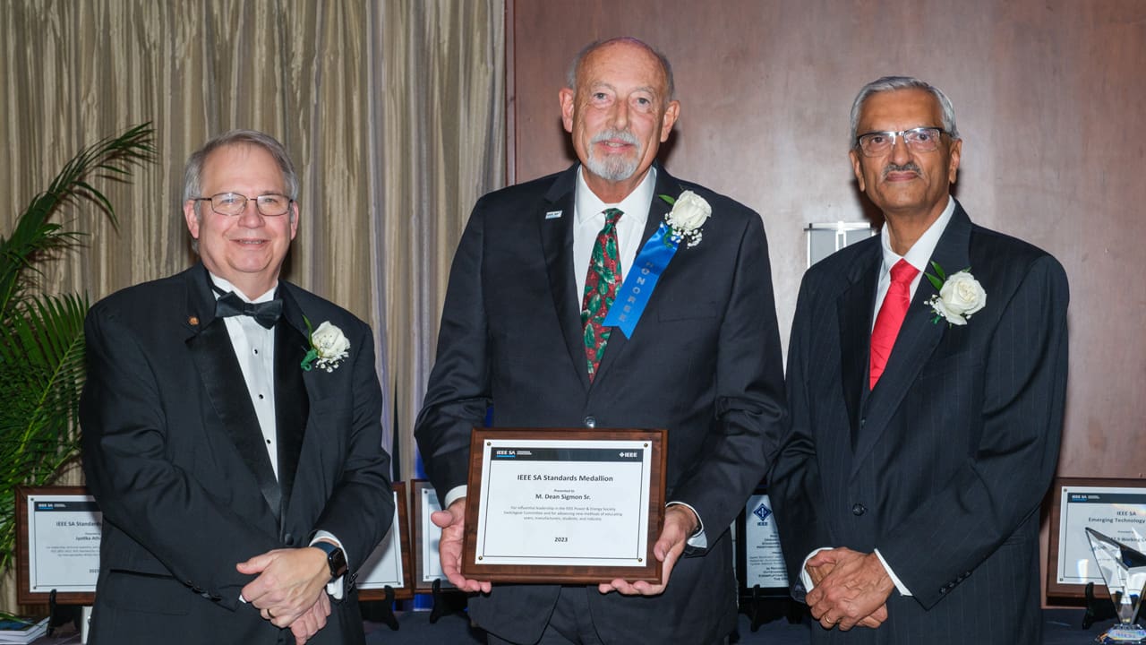 Recipient posing with award