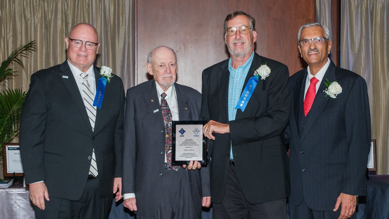 Recipient posing with award