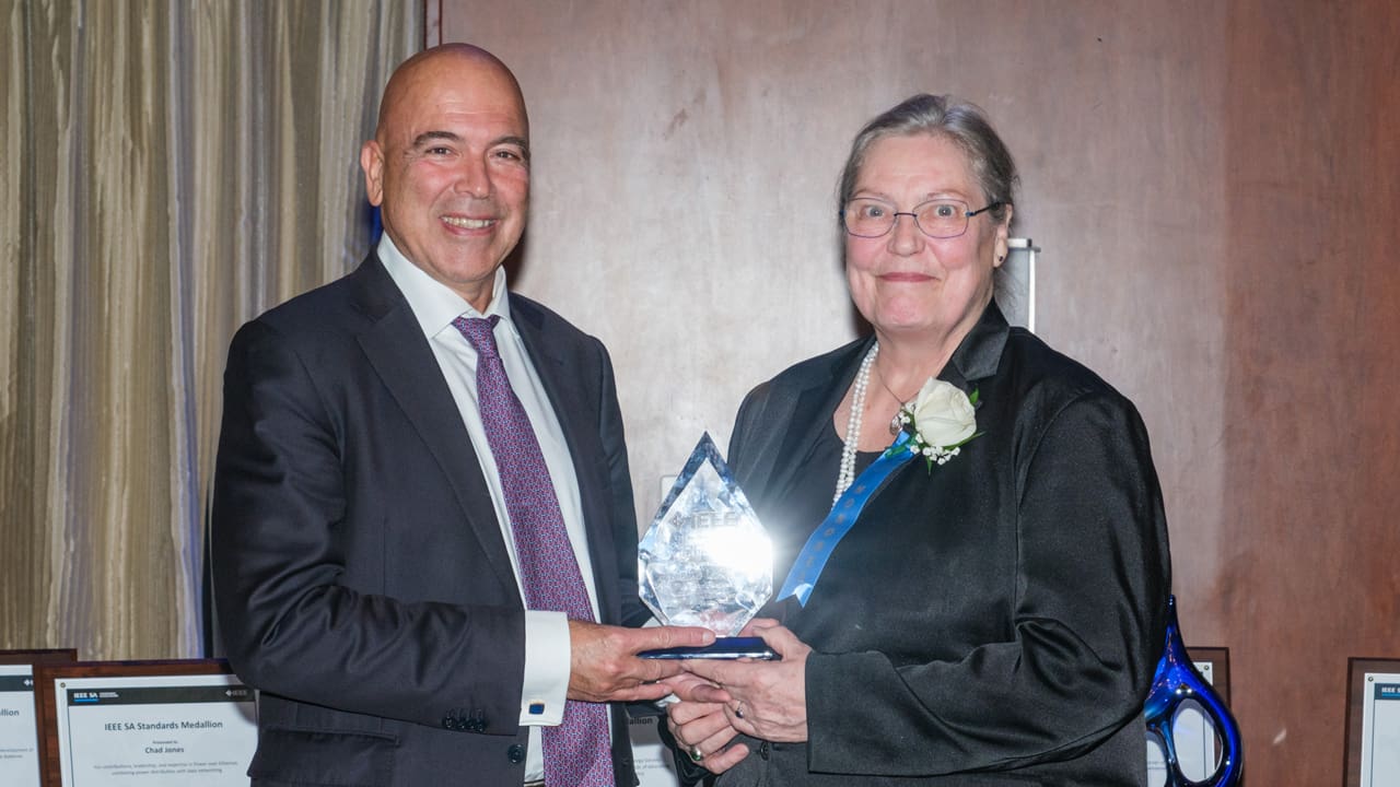 Recipient posing with award