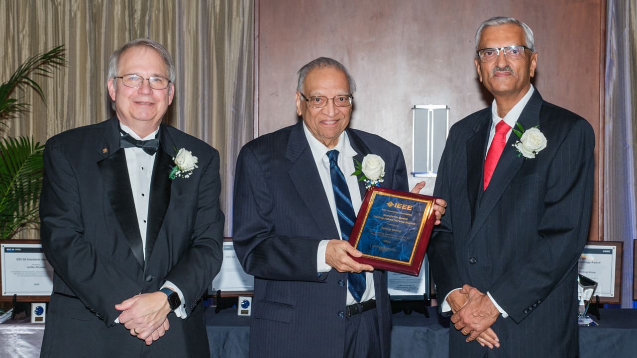 Recipient posing with award