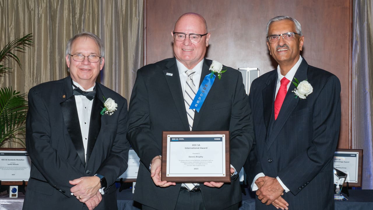 Recipient posing with award