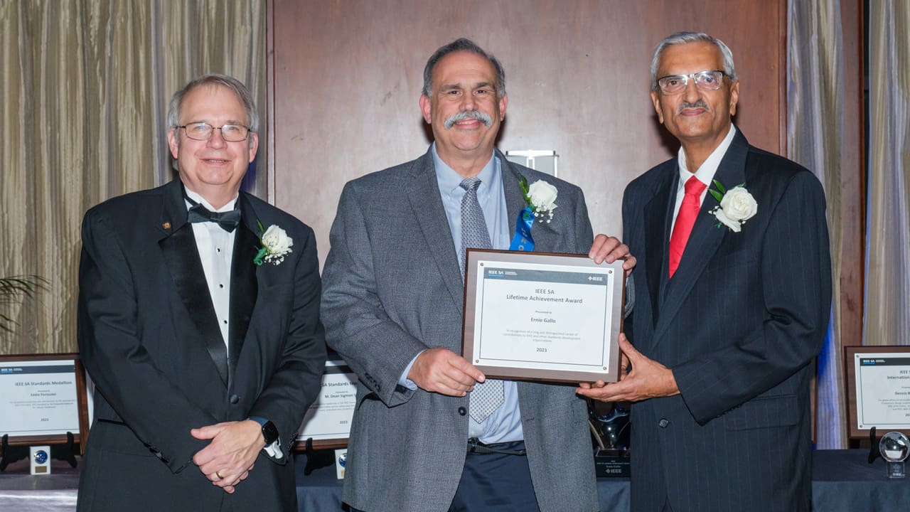 Recipient posing with award