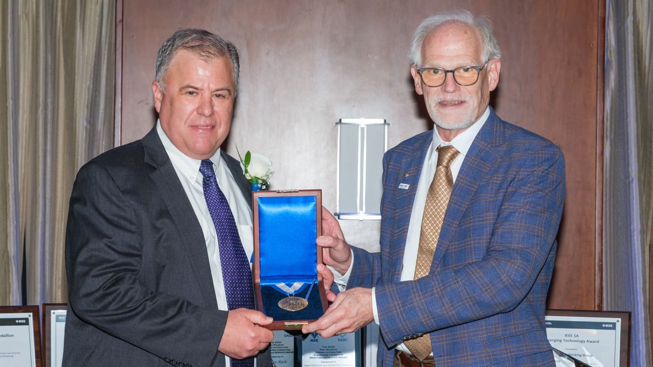 Recipient posing with award