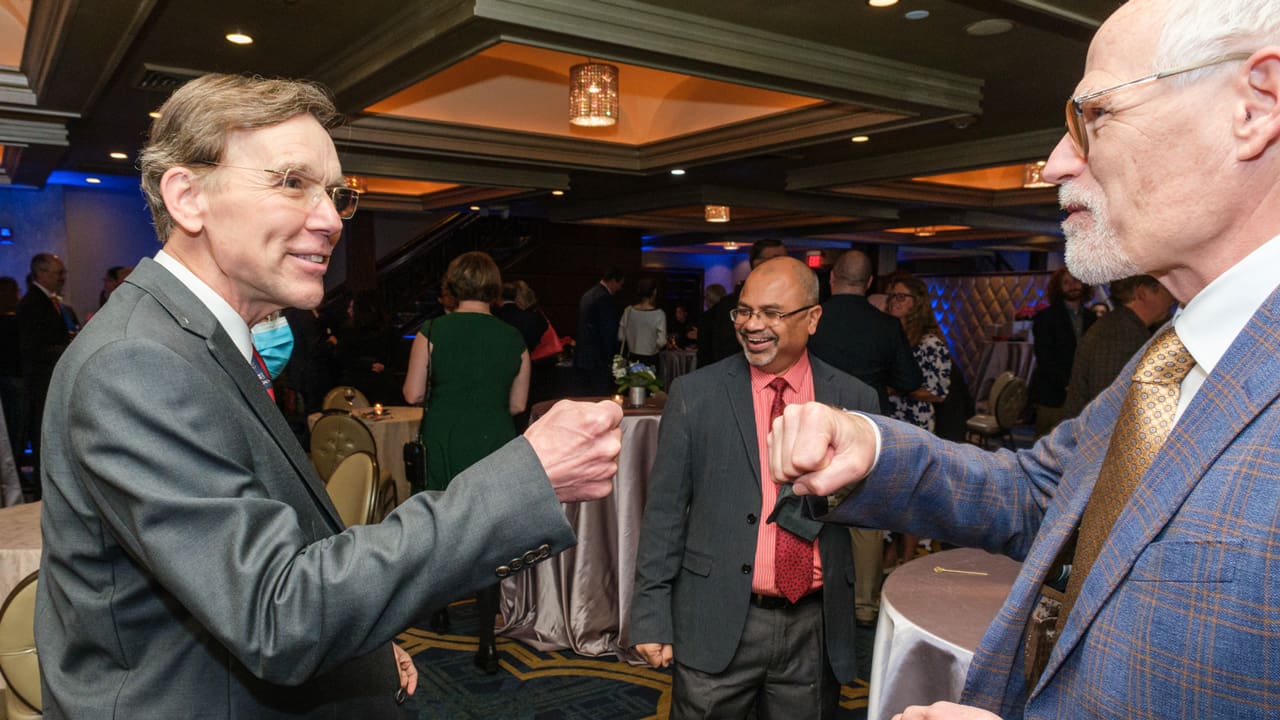 Two people doing a fist bump