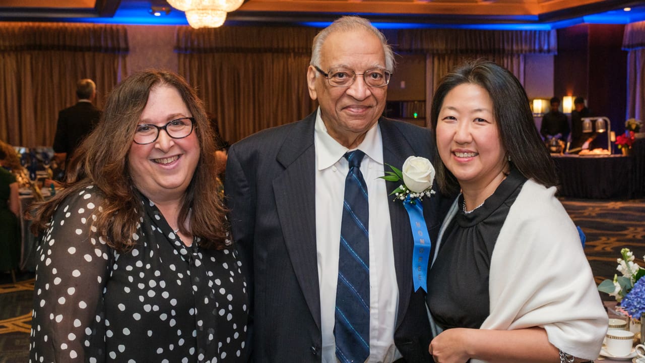 Three people posing for a picture