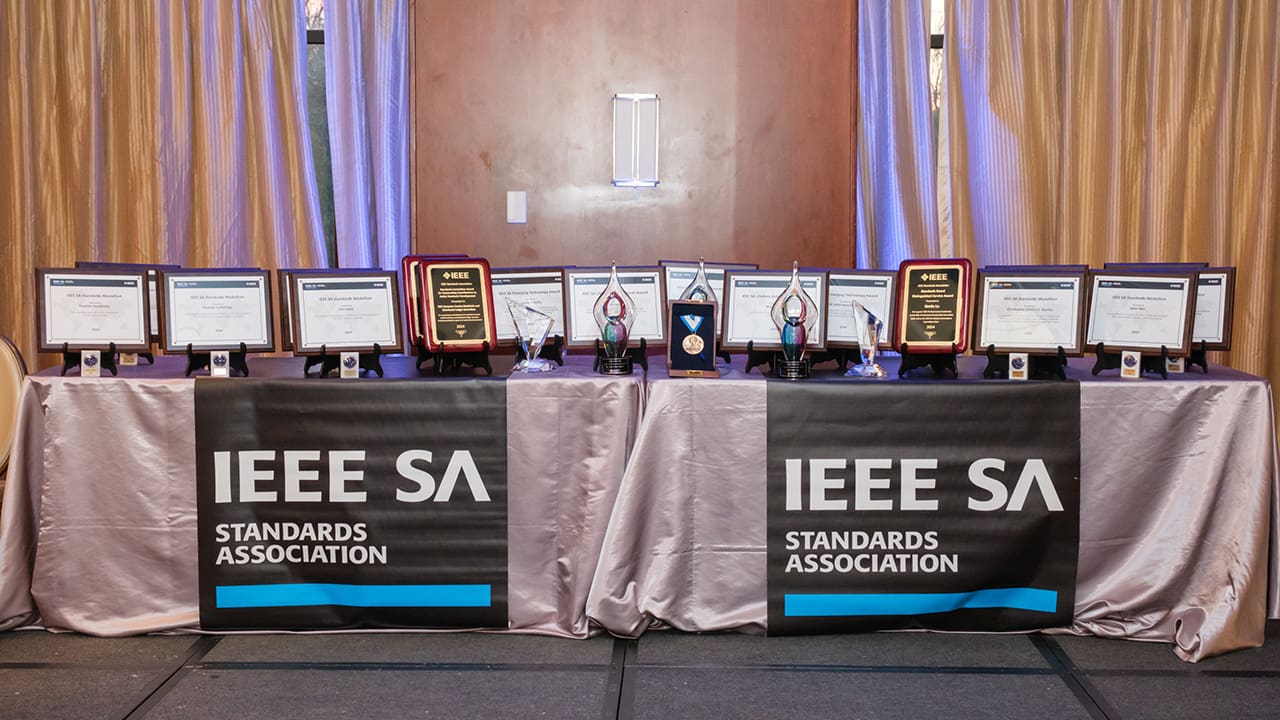 The 2024 IEEE SA Awards resting on a table.