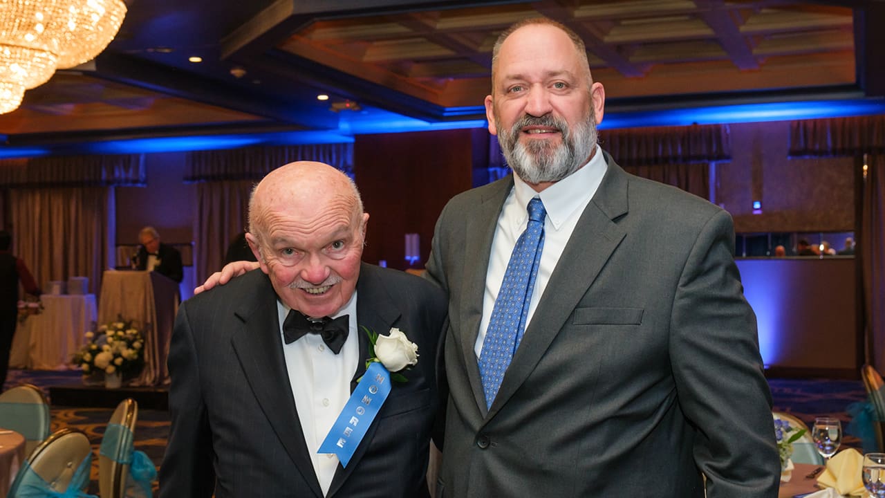 Two IEEE SA Awards attendees posing for a photo.