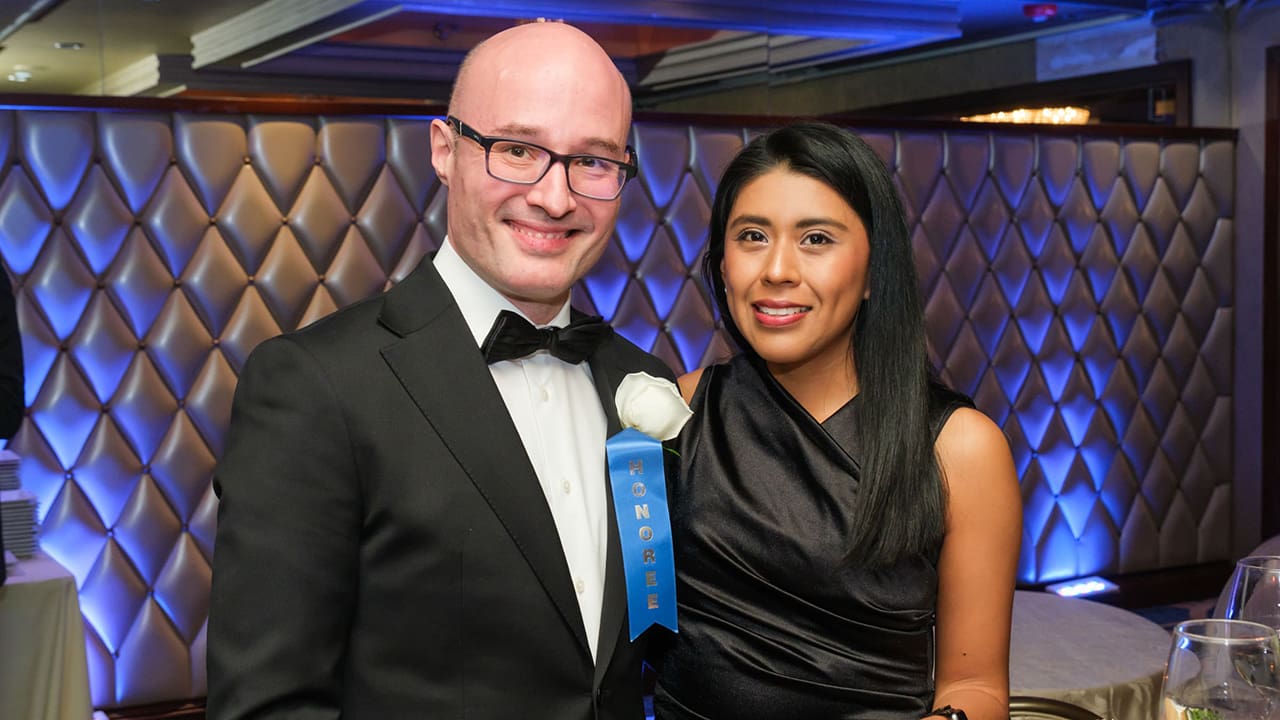 Two IEEE SA Awards attendees posing for a photo.